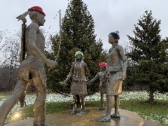 indian statues with sock hats